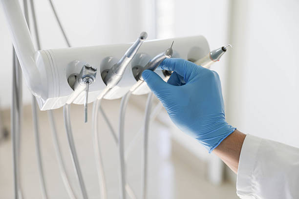 Professional Tooth Extraction technician working in McGraw, NY